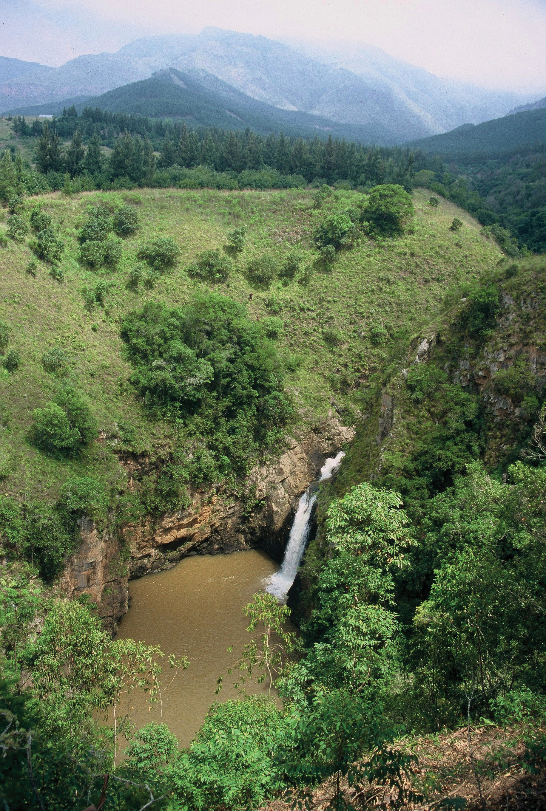 A deep canyon with a waterfall and a river below, in Limpopo.